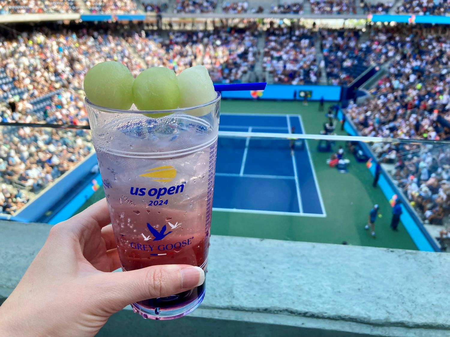 A Honey Deuce with a backdrop of Louis Armstrong Stadium