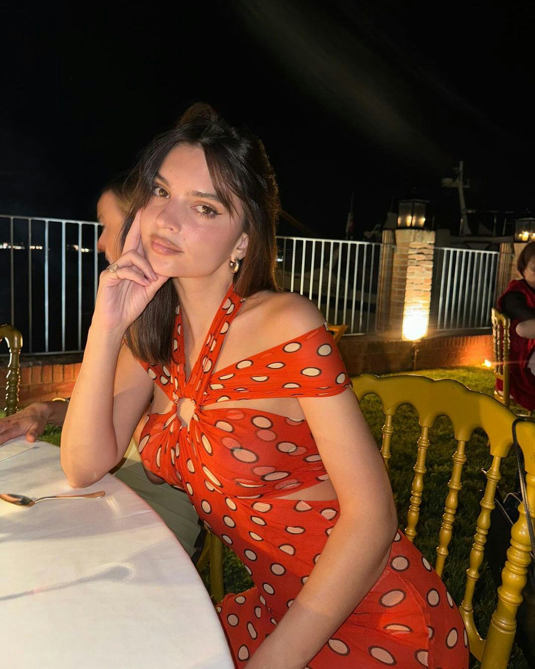 Emily Ratajkowski wears a Jean Paul Gaultier dress.