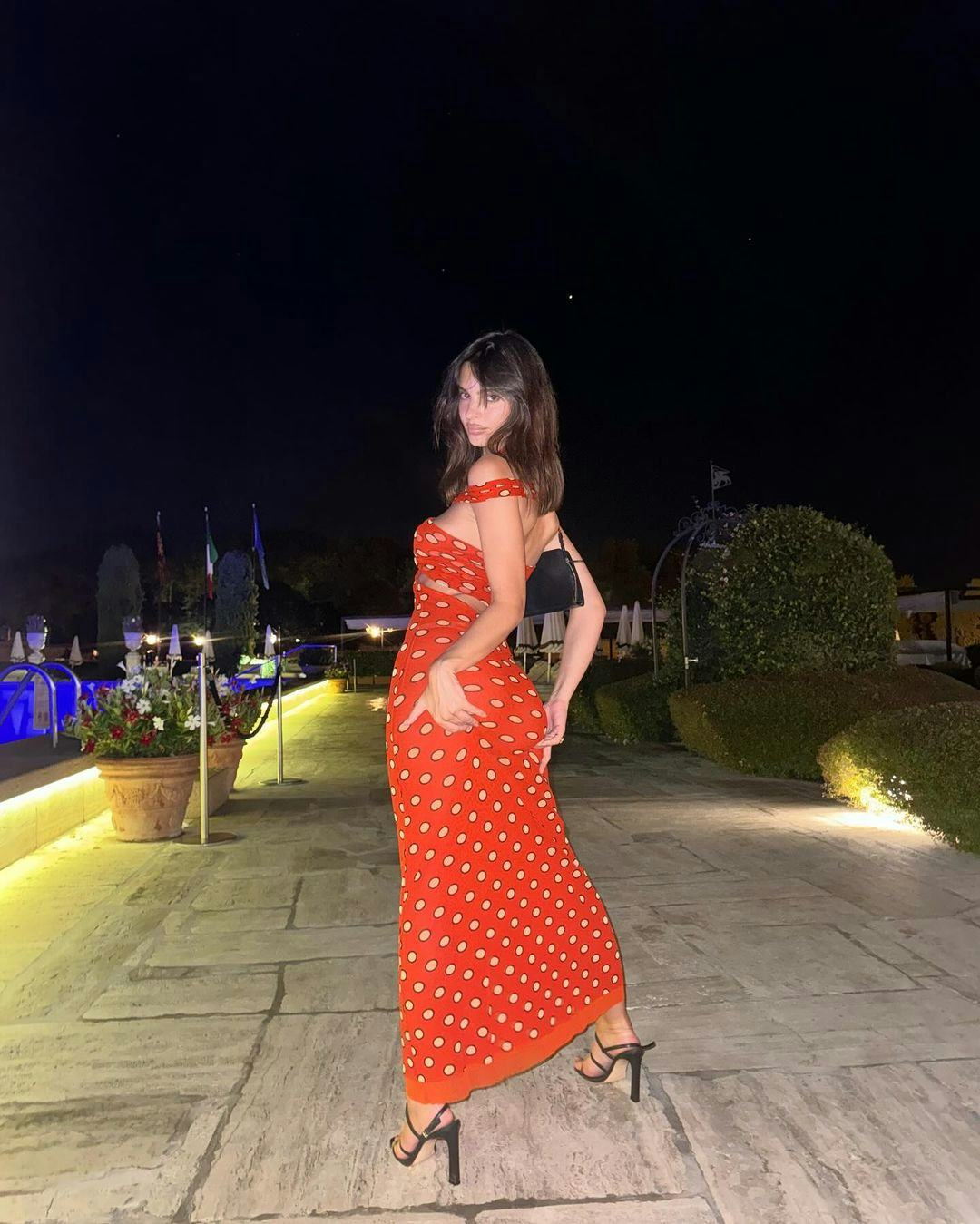 Emily Ratajkowski wears a Jean Paul Gaultier dress.