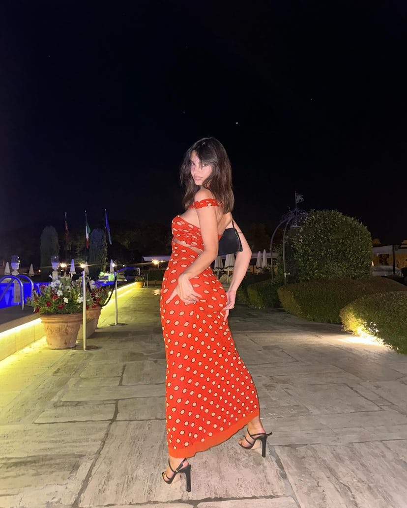 Emily Ratajkowski wears a Jean Paul Gaultier dress.