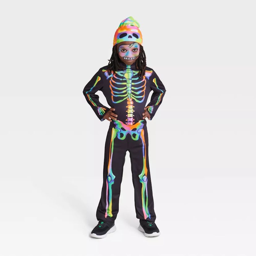 Kids' Blacklight Responsive Color Melt Skeleton Halloween Costume Jumpsuit with Beanie from target's...