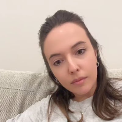 A woman sitting on a couch looks thoughtfully at the camera, with text asking if kids should change clothes after school.