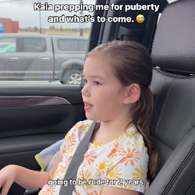 A young girl sits in a car, wearing a floral shirt and enjoying fries. Text on the image humorously discusses puberty and behavior changes.