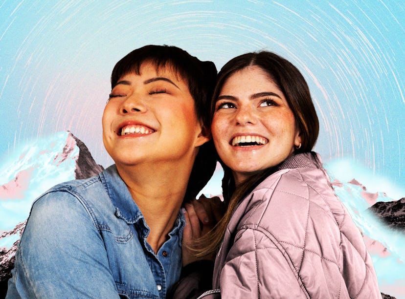 Two young women in front of a snowy mountain backdrop manifesting during the best dates in fall 2024...