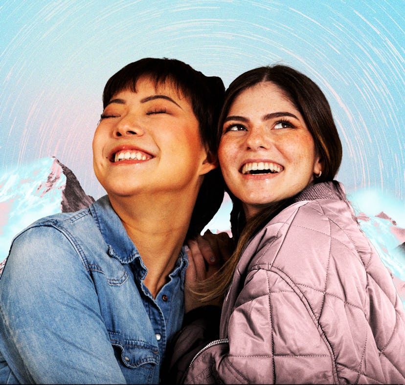 Two young women in front of a snowy mountain backdrop manifesting during the best dates in fall 2024...