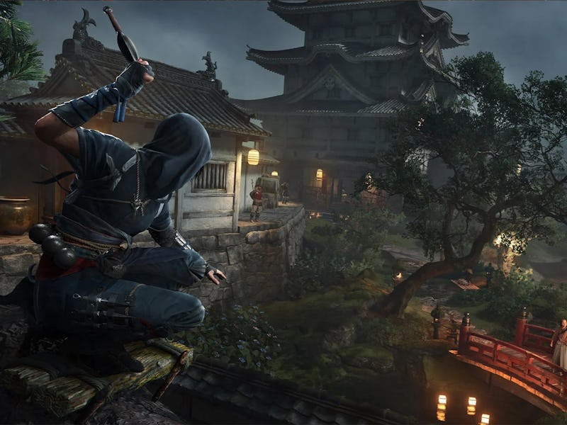A cloaked figure crouches on a ledge overlooking a tranquil village scene at night, featuring a red ...