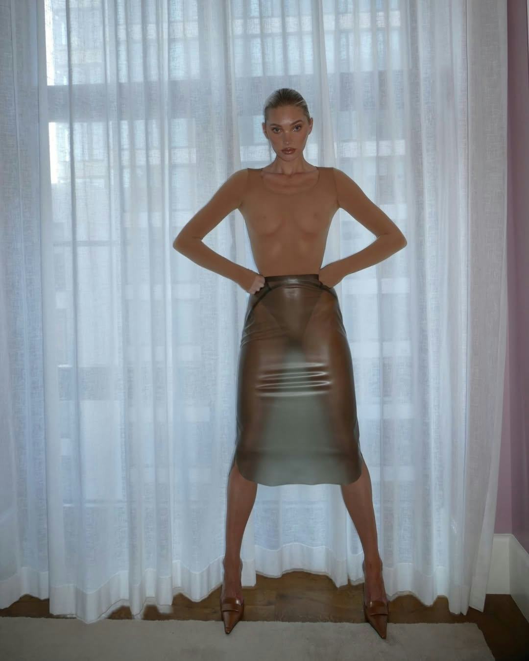 Elsa Hosk wears a see-through top and skirt.