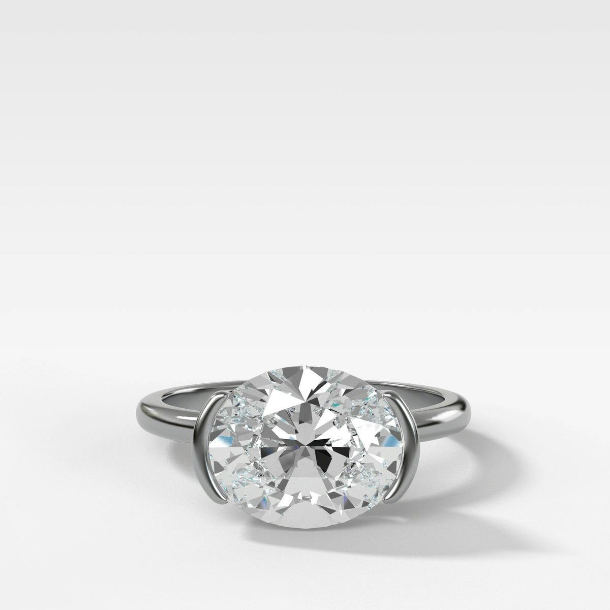 East West Half Bezel Solitaire Engagement Ring With Oval Cut Diamond