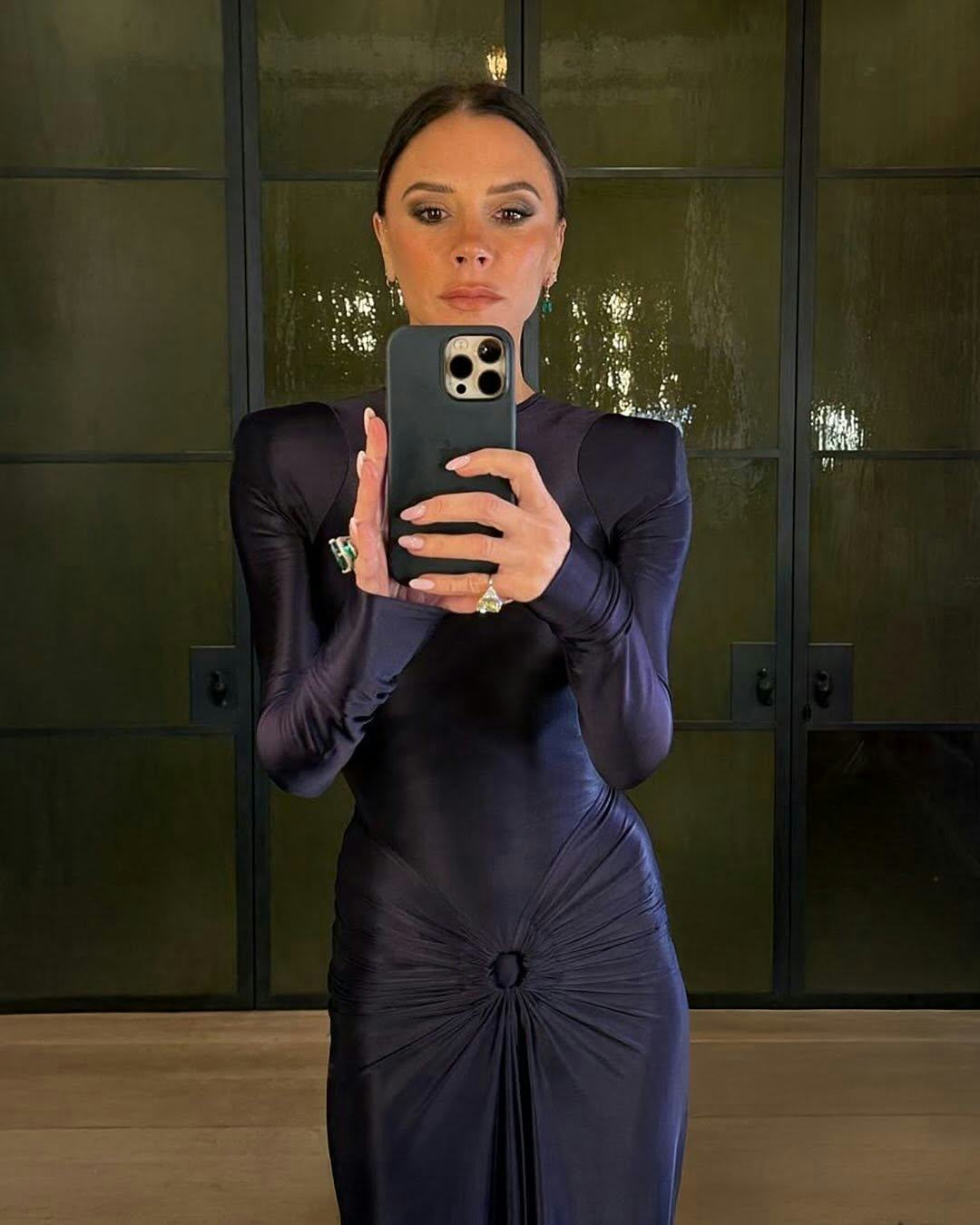 Victoria Beckham wears a maxi dress.