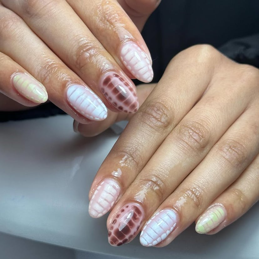 Celebrate the 2025 Lunar New Year with a snake-inspired manicure.