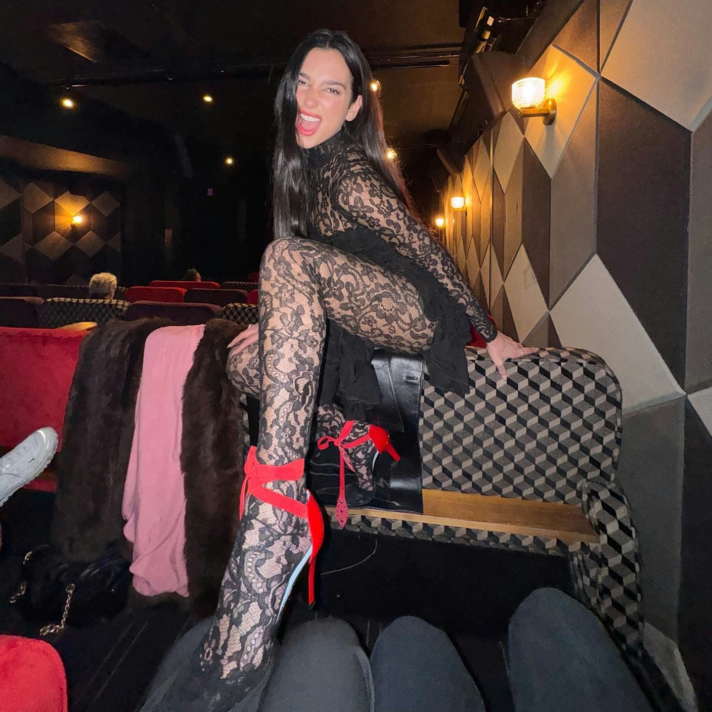 Dua Lipa wore a lacy catsuit.