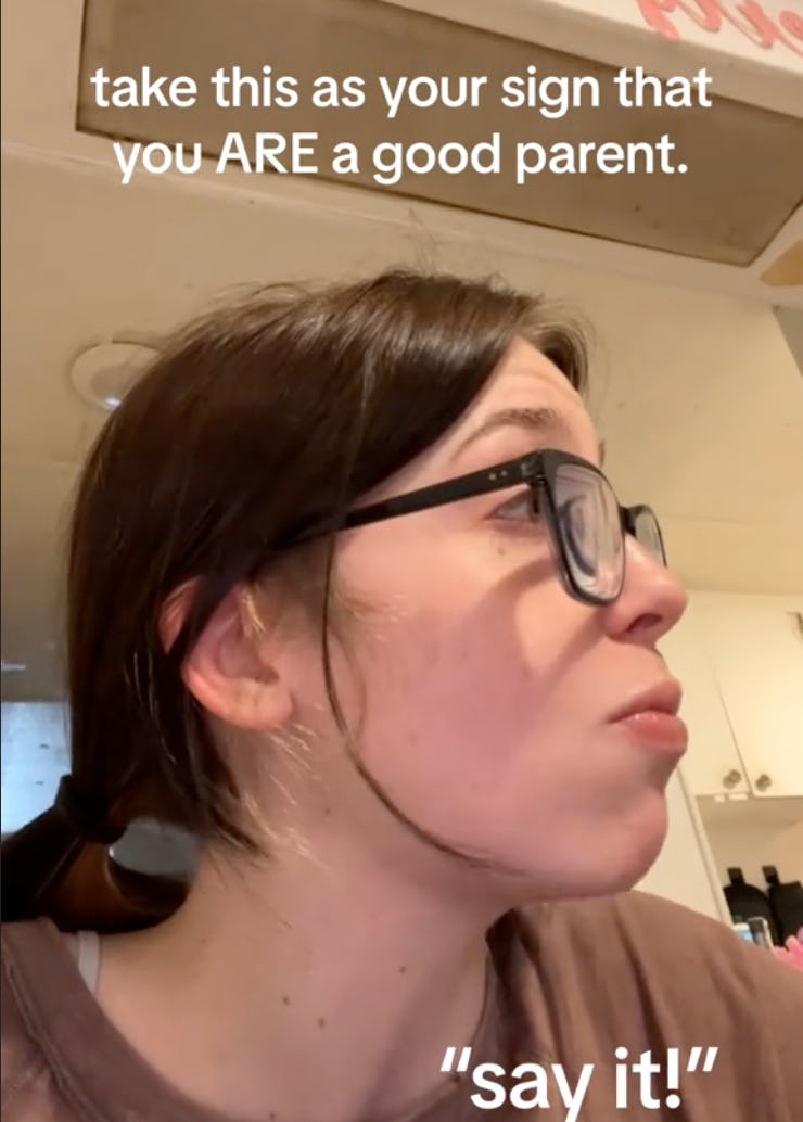 A woman with glasses is looking to the side, with a thoughtful expression. Text above her reads, "take this as your sign that you ARE a good parent."