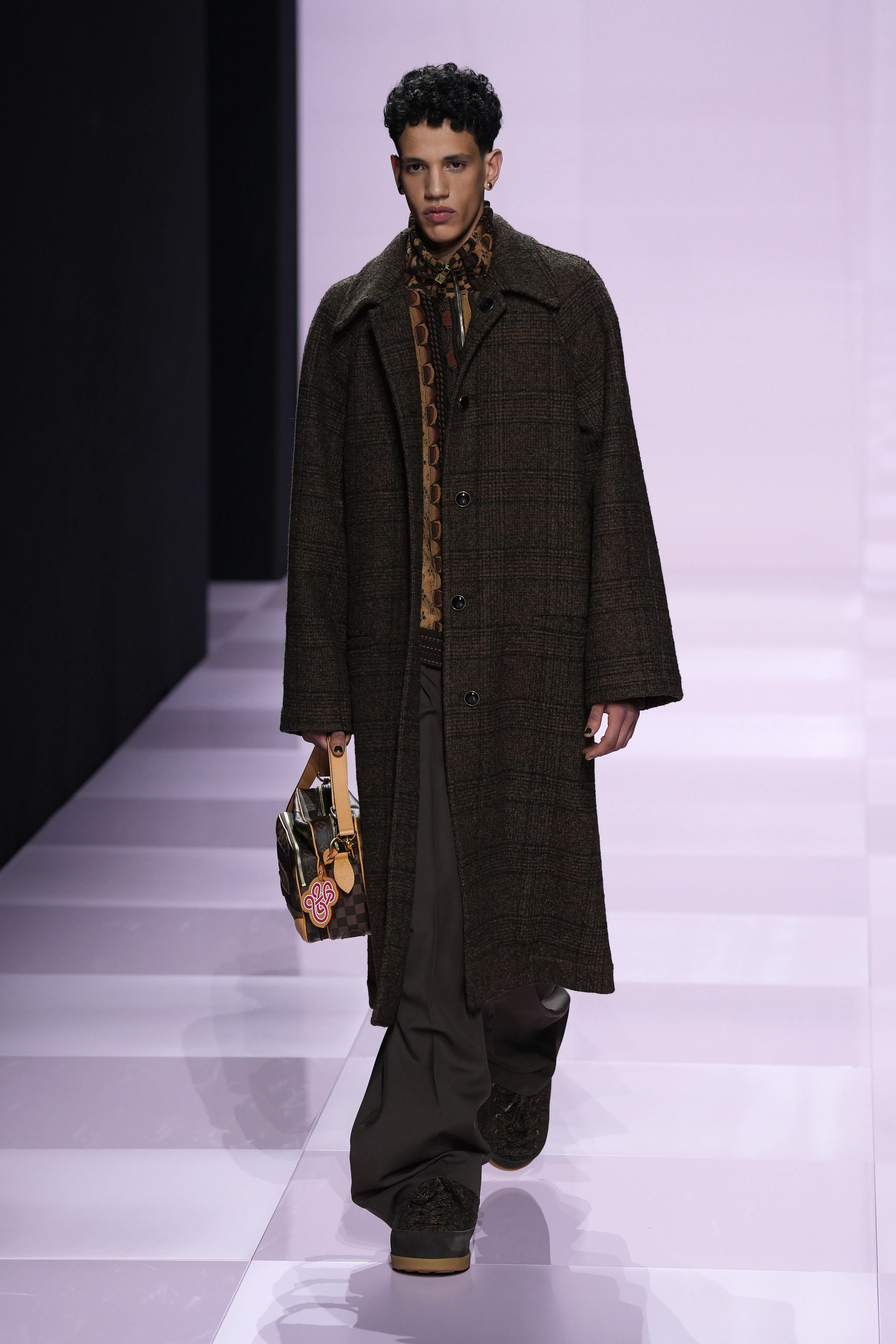 A model walks the runway during the Louis Vuitton Menswear Fall-Winter 2025/2026 show as part of Par...
