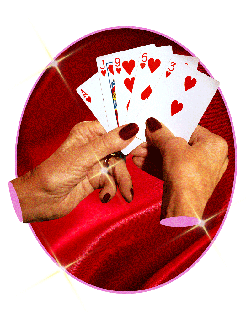 Hands hold playing cards.