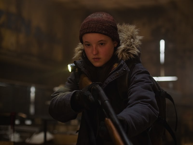 A young girl in a dark, abandoned setting holds a rifle with a focused expression, dressed in a warm...