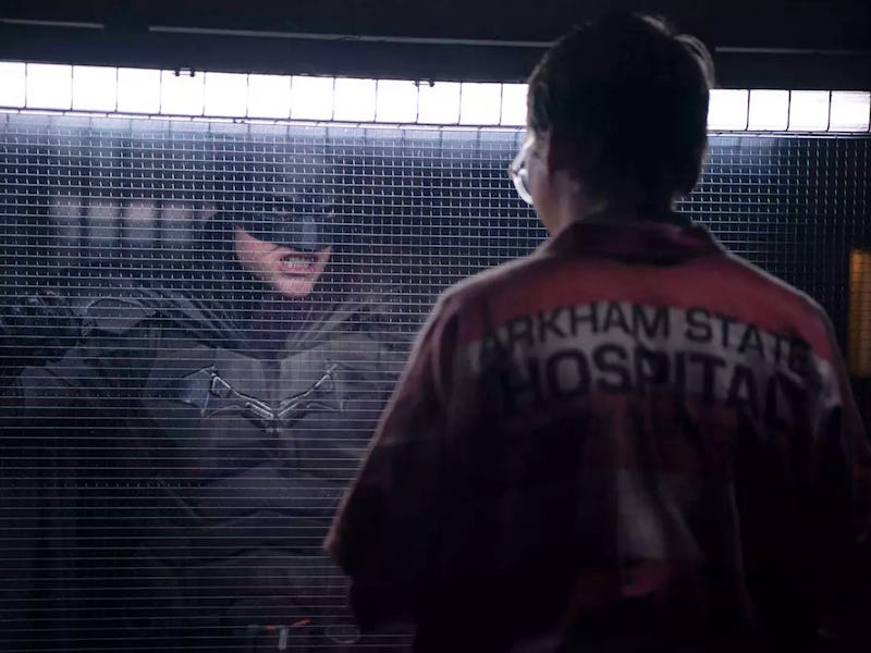 Batman (Robert Pattinson) faces The Riddler (Paul Dano) in Arkham Asylum in The Batman