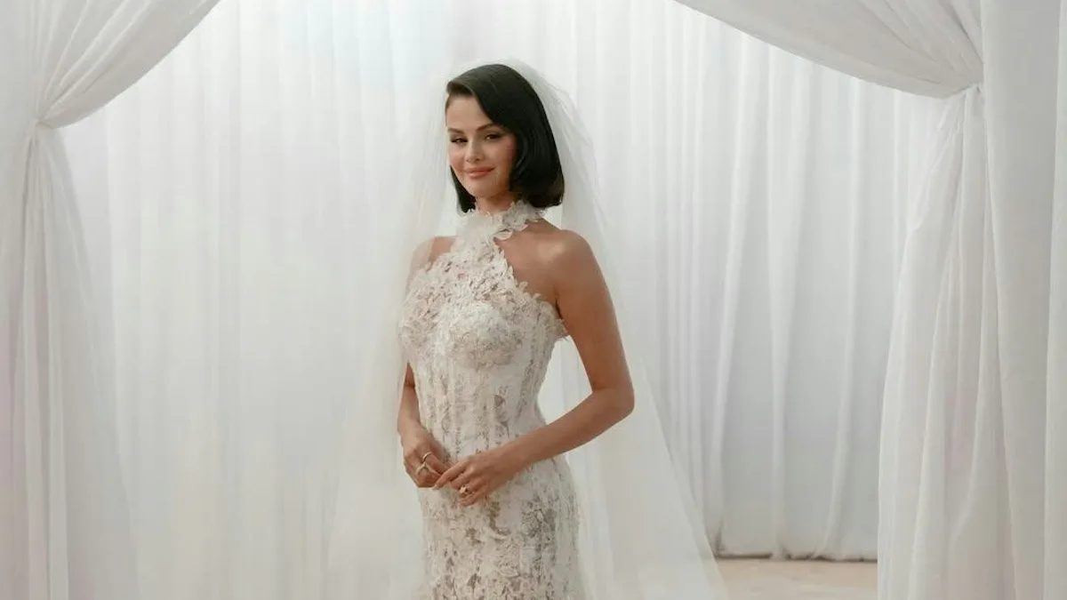 selena gomez lace wedding dress #SelenaGomezs custom #RLCollection silk-lace ceremony gown featured a hand-painted corset with crystal and lace embellishments., More than 300 hand-shaped lace flowers were placed onto a cascading