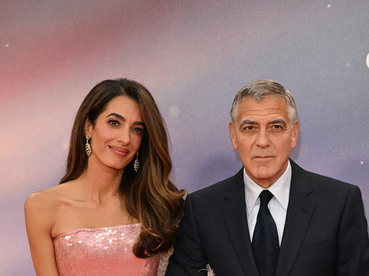 Amal Clooney Stuns in Sequin Fringe Dress With Feather Cape at George's Premiere Amal Clooney Stuns in Sequin Fringe Dress With Feather Cape at George's Premiere