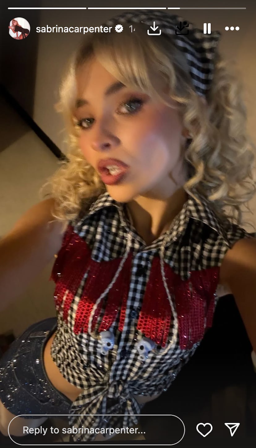 Sabrina Carpenter wears a sleeveless top and shorts.