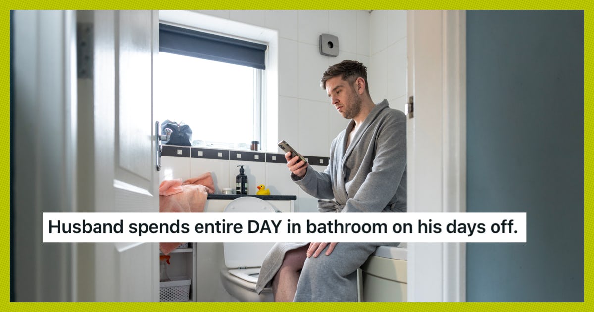 Man in a bathrobe sits on a toilet, looking at his phone. The bathroom has white tiles and a window with a black blind. Text: "Husband spends entire DAY in bathroom on his days off."