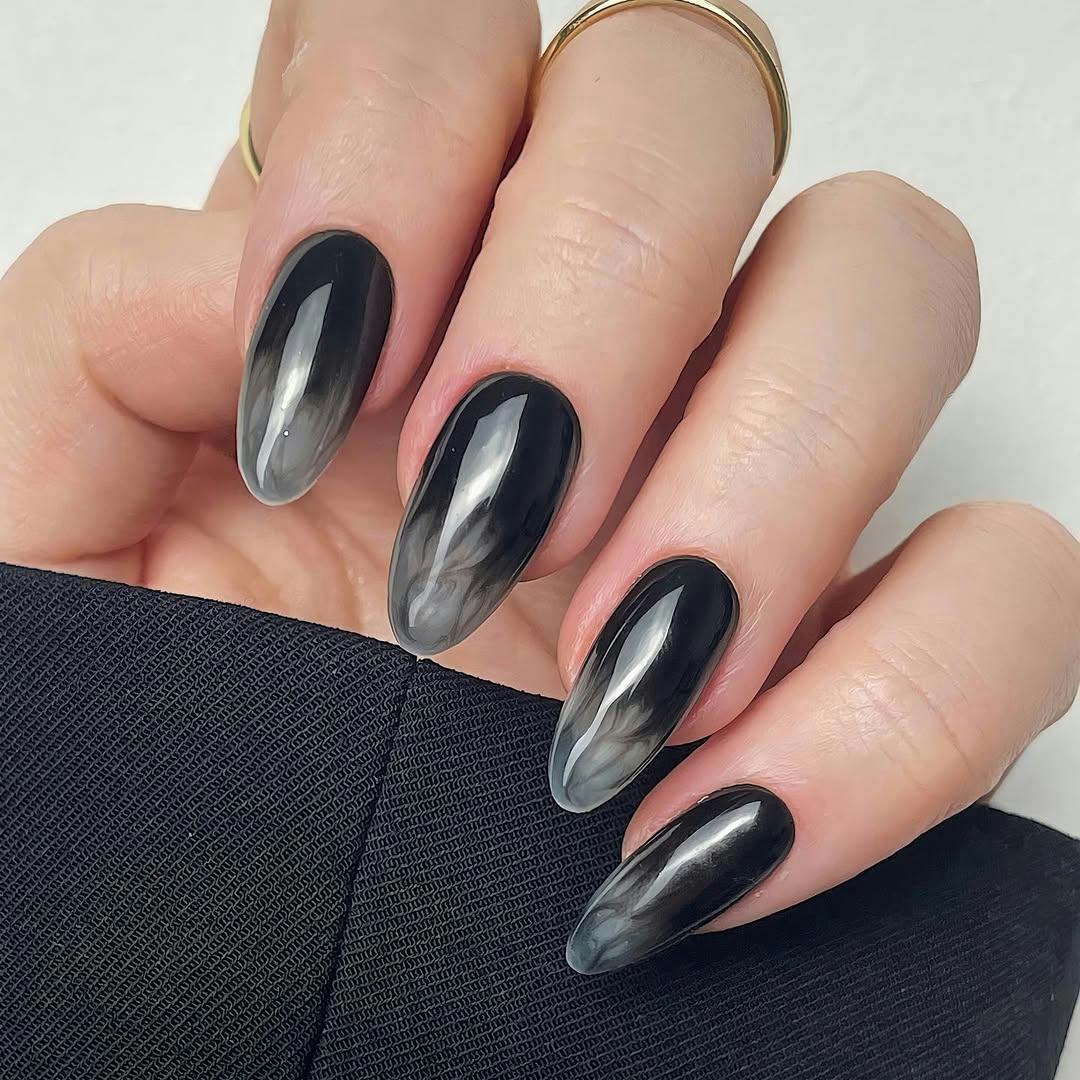 TikTok's "Smoke Nail" Trend Brings Witchy, 'Practical Magic' Energy To Your Mani