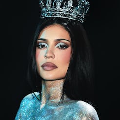 Kylie Jenner wears nothing but glitter and a g-string.