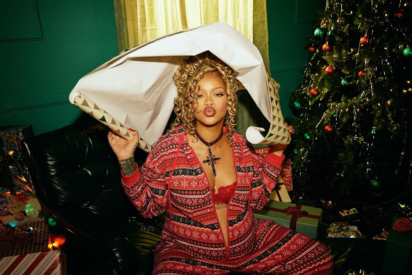 Rihanna wearing a Savage X Fenty holiday onesie.