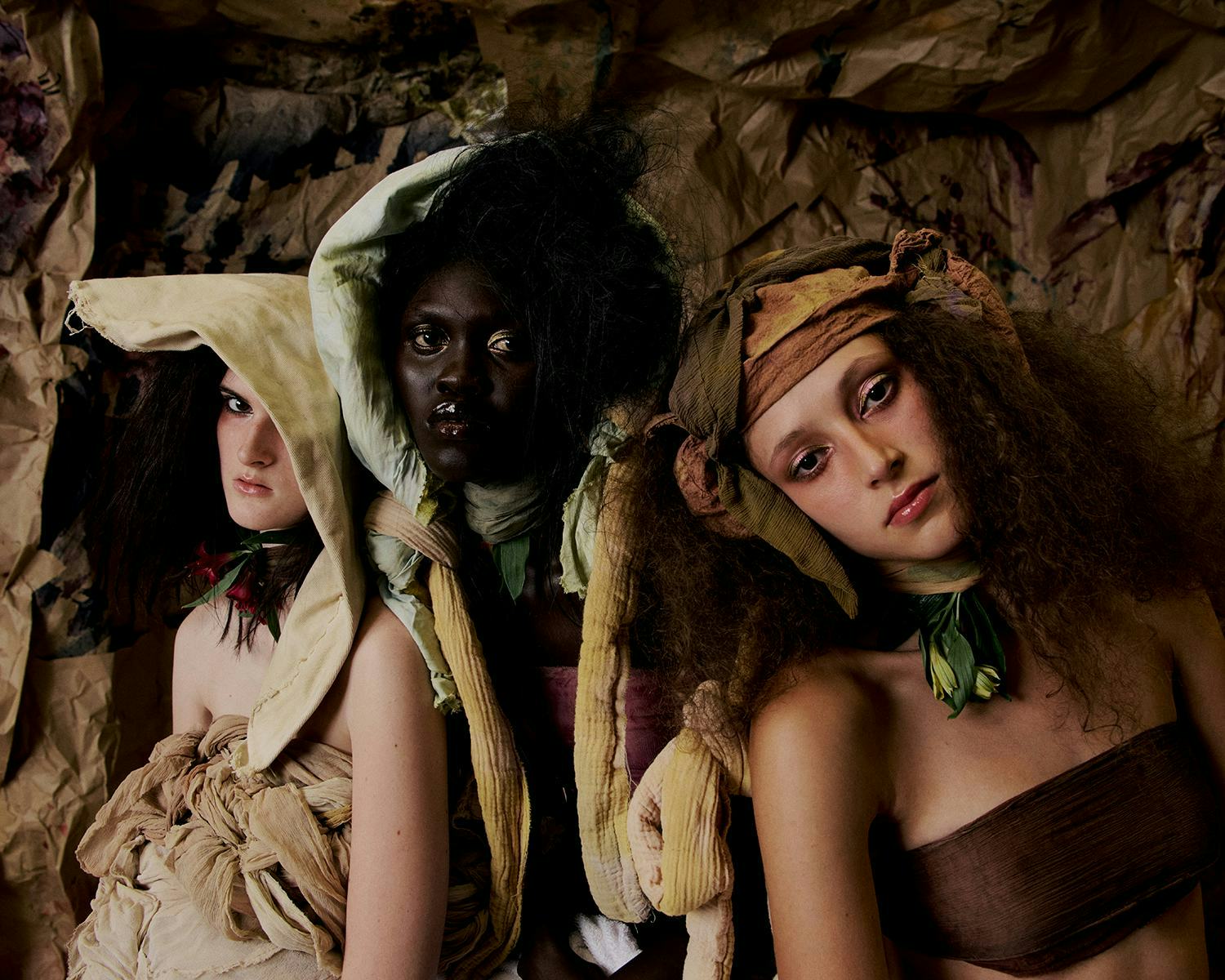 Three models wearing Paolo Carzana clothing