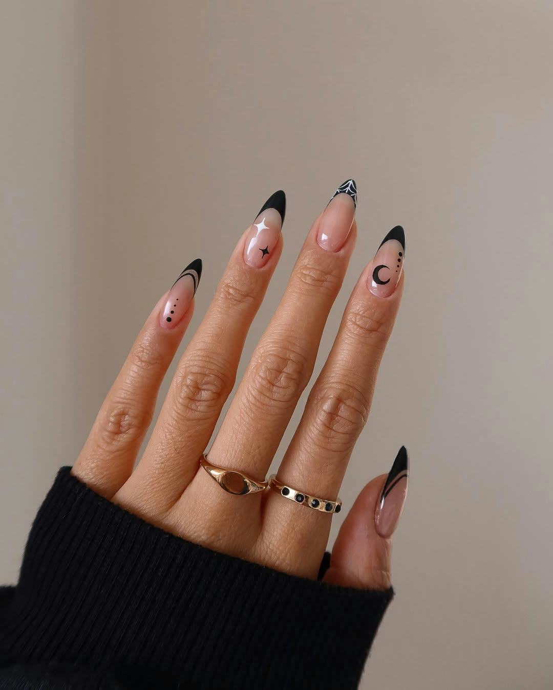 Here are 13 subtle, spooky, and spidery Halloween nail art ideas for fall 2025.
