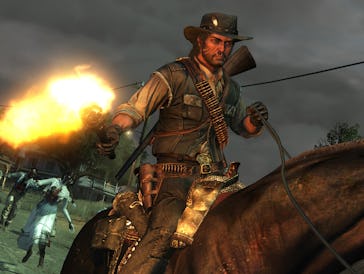 John Marston rides his horse with zombies trailing behind him.