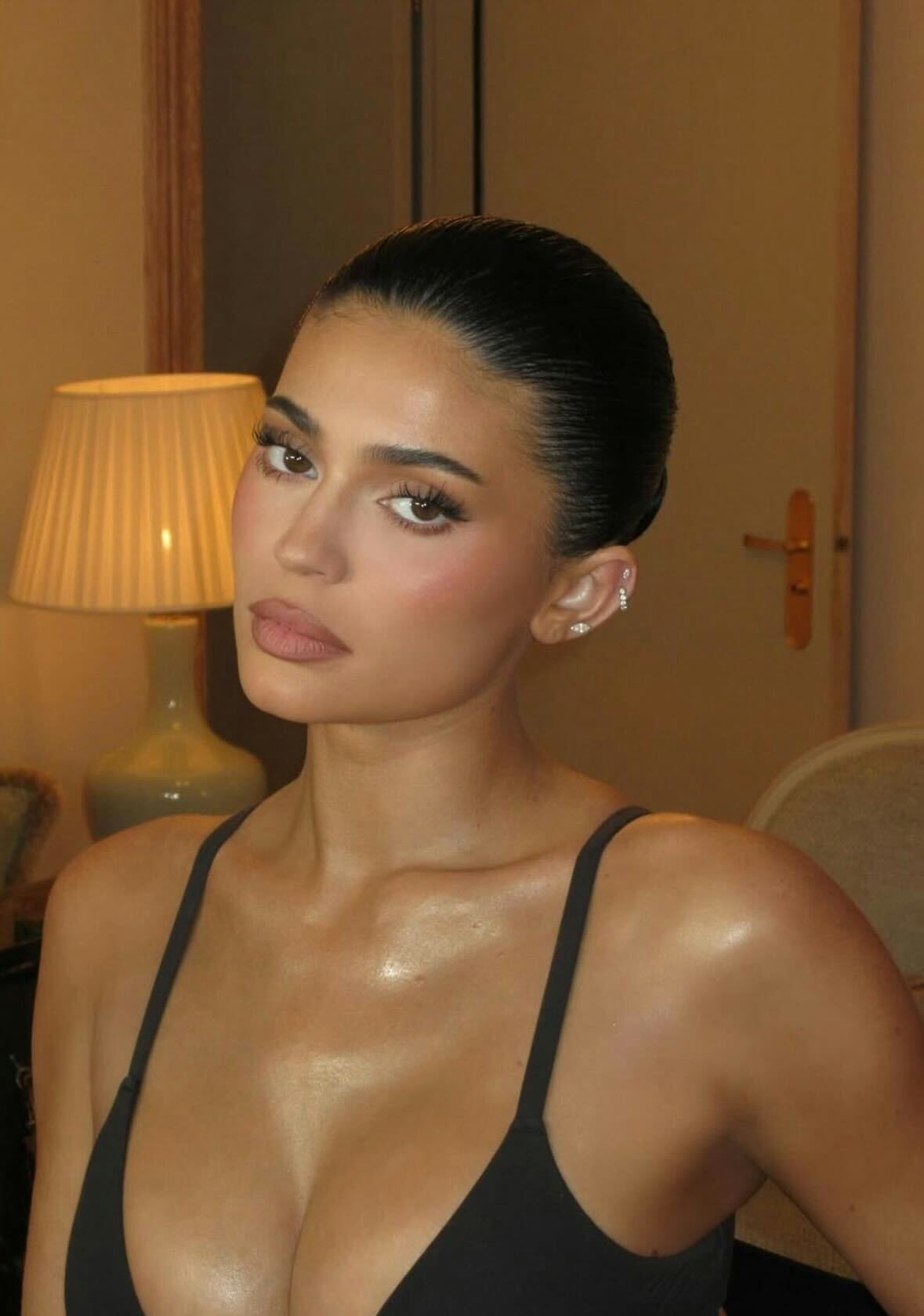 Kylie Jenner shows off her beauty look with a black bra at Paris Fashion Week