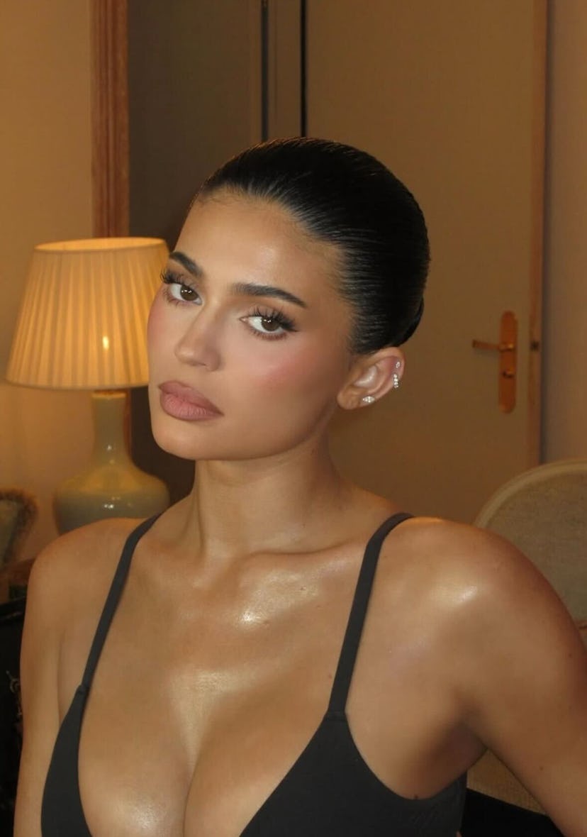 Kylie Jenner shows off her beauty look with a black bra at Paris Fashion Week