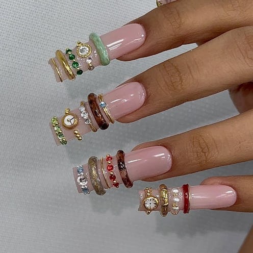 The bangle nail trend takes your bracelet stack and shrinks it to adorn on your fingertips.