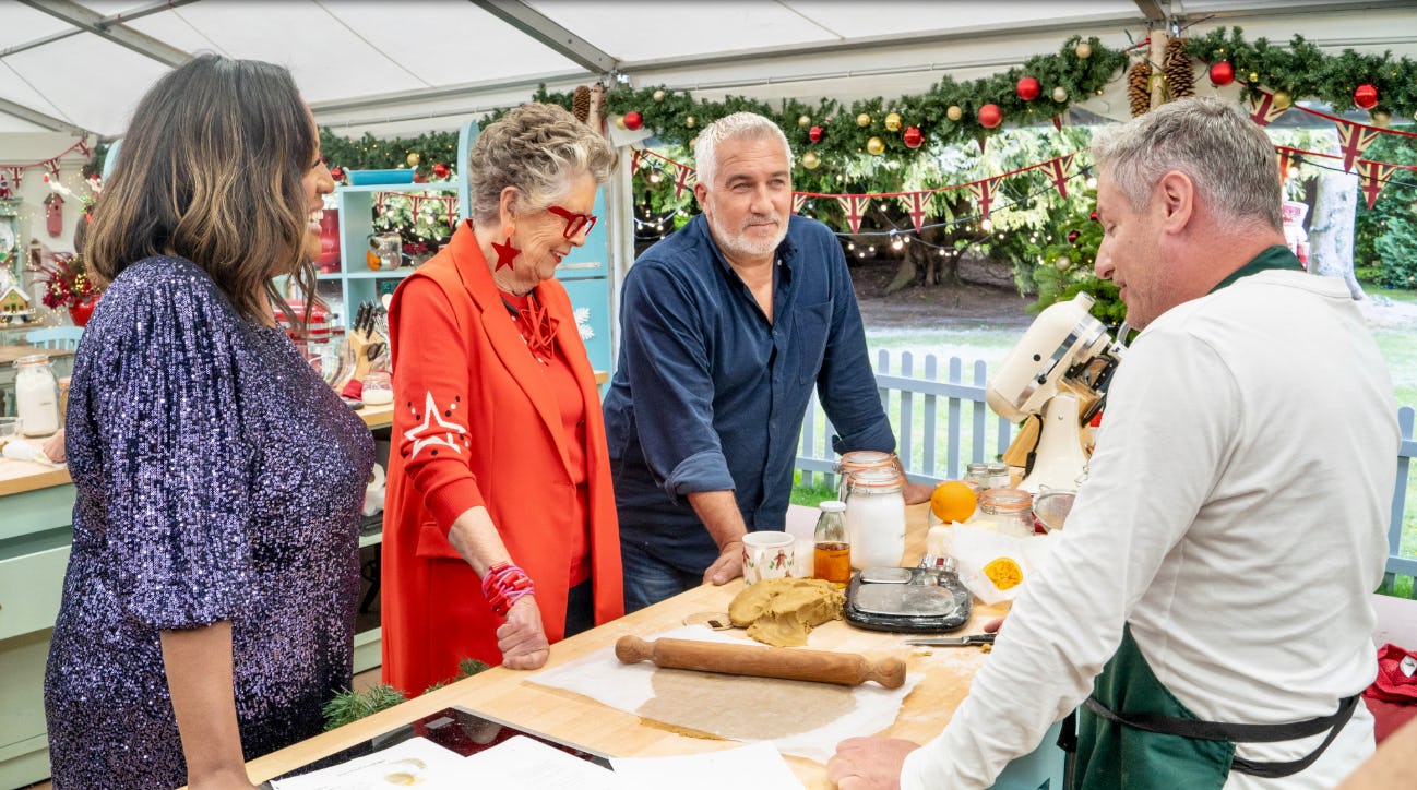 the hosts of great british baking show assess a contestant's creation