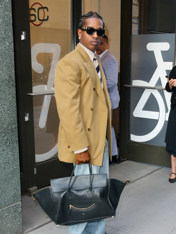 A$AP Rocky carrying Celine's New Luggage.