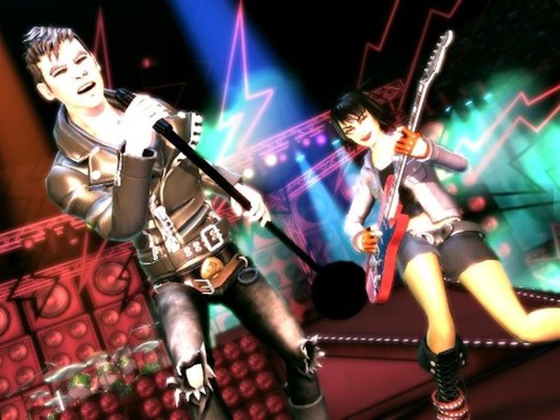 Animated scene of two musicians performing energetically on stage, with one singing into a microphon...