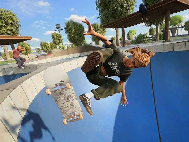 A person with a beanie performs an aerial trick on a skateboard in a blue skatepark bowl, surrounded...