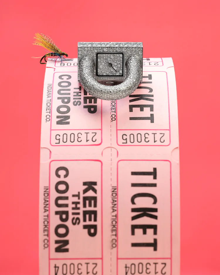 Van Cleef & Arpels watch on a role of tickets