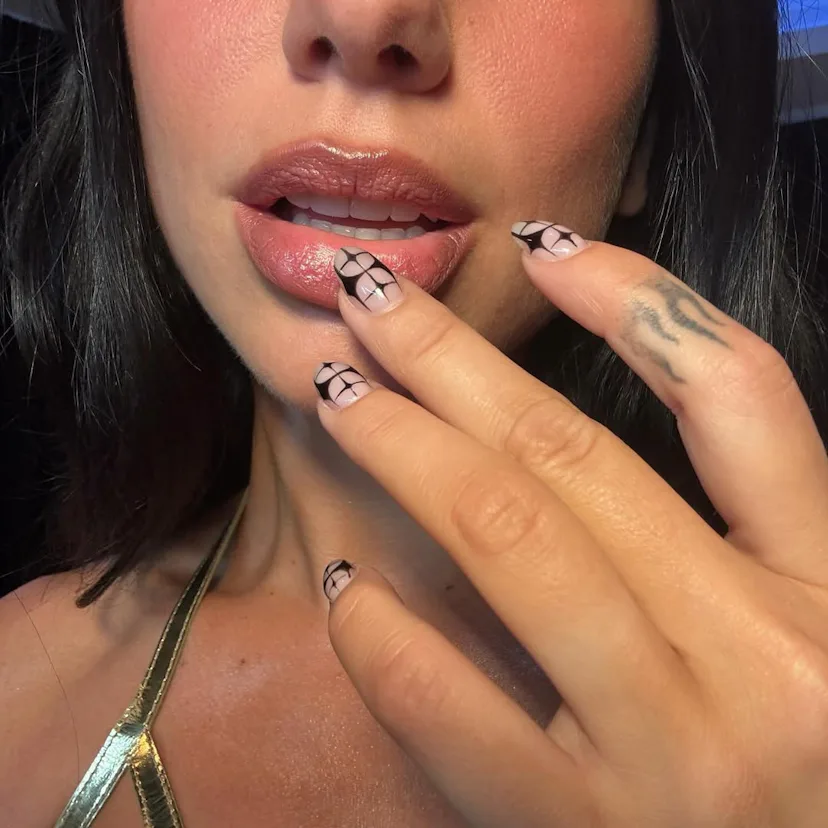 Dua Lipa with negative space nails