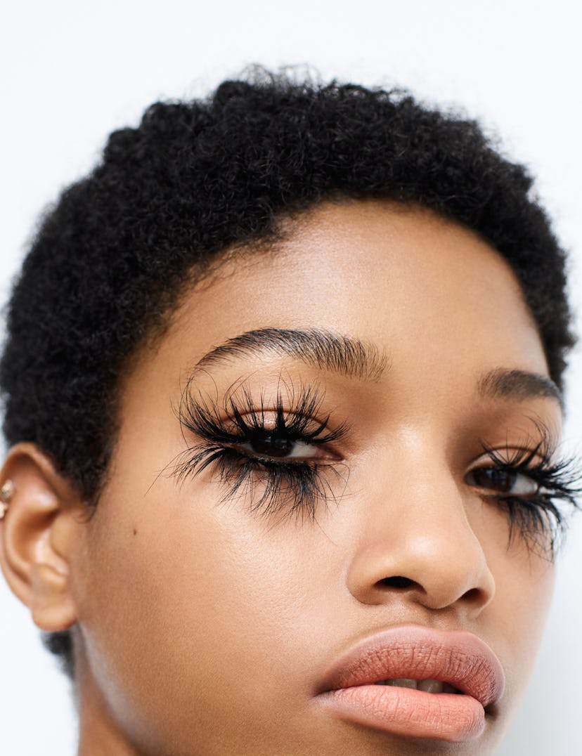 a person with huge long spiderlike eyelashes