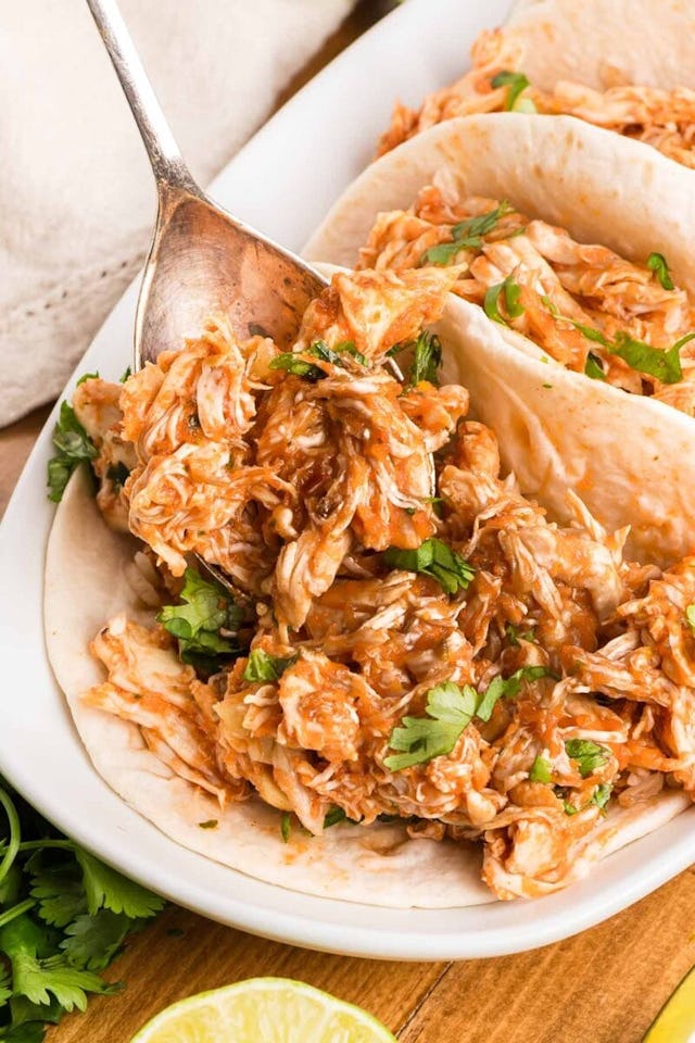 shredded salsa chicken in the crockpot, in a story about cheap recipes to feed a crowd