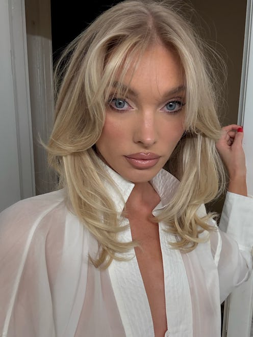 Elsa Hosk wears a white top.