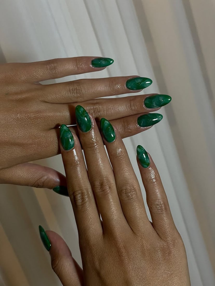 Emerald green nails.