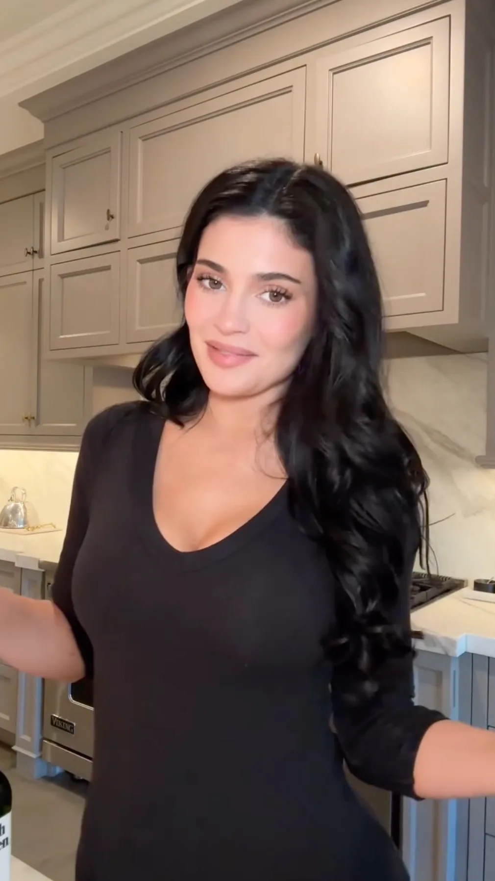 Kylie Jenner looked chic in a plunging black top.