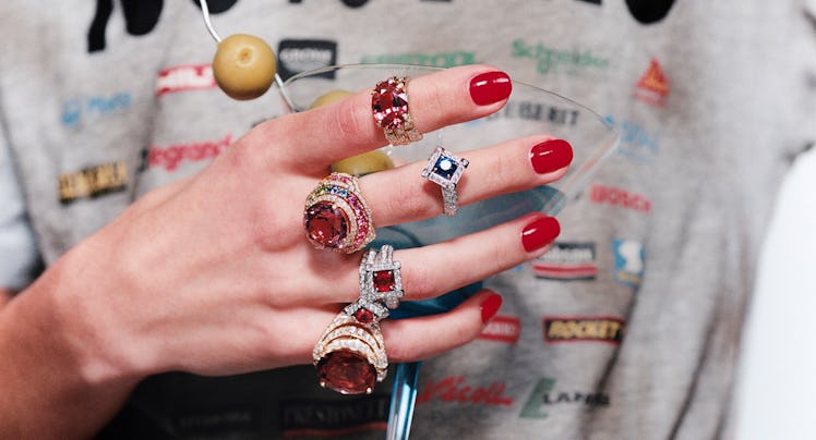 A model with jewelry on her fingers