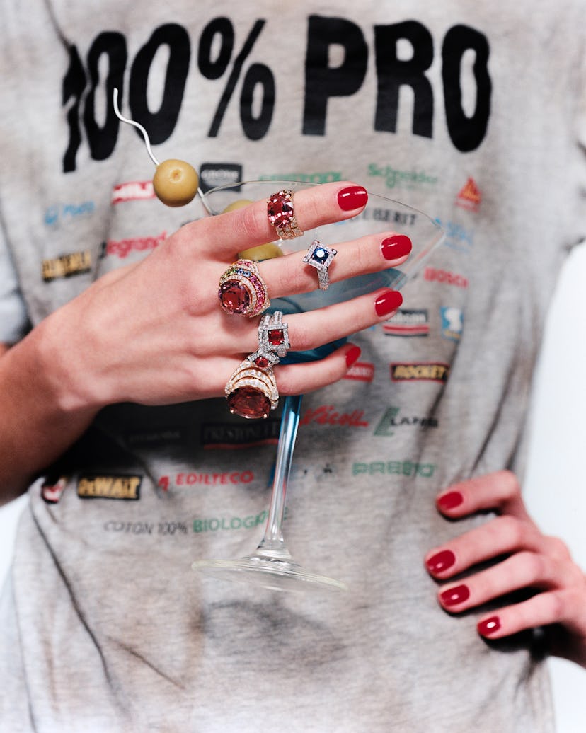 A model with jewelry on her fingers