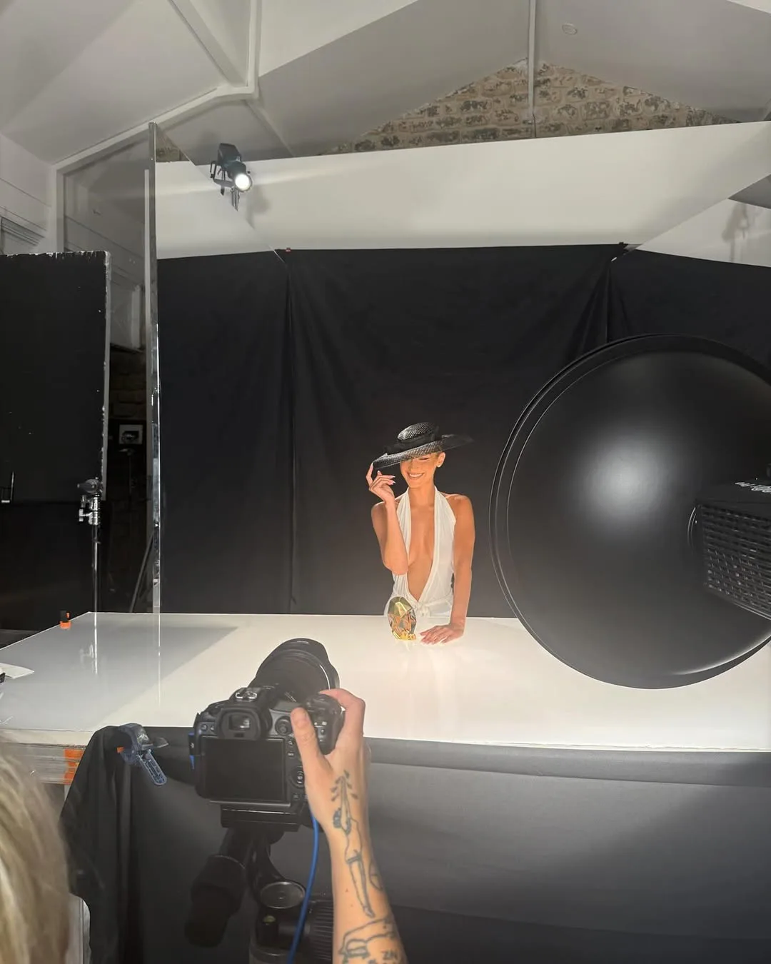 Bella Hadid wore a plunging white dress in a new Ôrebella photo shoot.