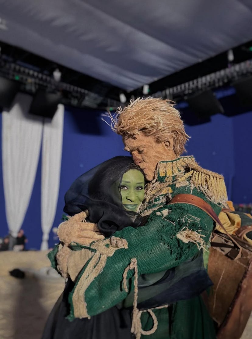 Cynthia Erivo with scarecrow Jonathan Bailey behind the scenes of Wicked: For Good. Screenshot via I...