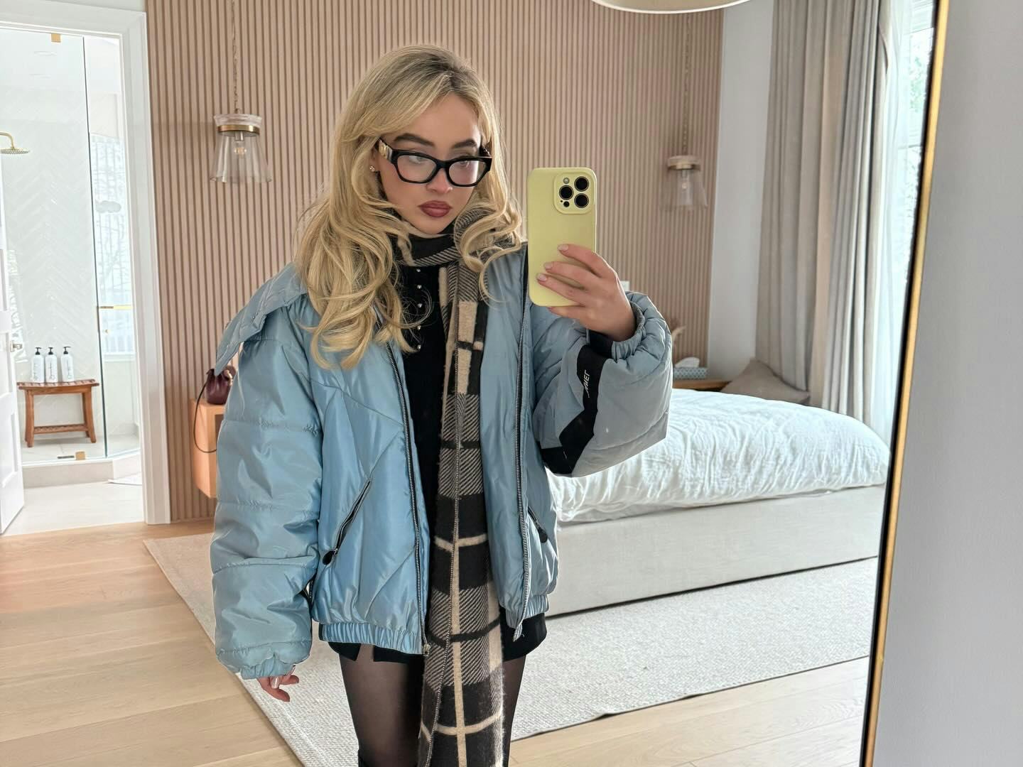 Sabrina Carpenter wears a black dress.