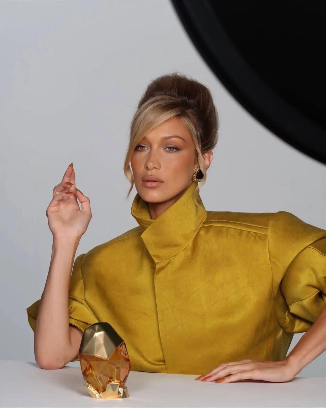 Bella Hadid wore a plunging white dress in a new Ôrebella photo shoot.